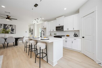 This is a modern, open-plan kitchen and dining are