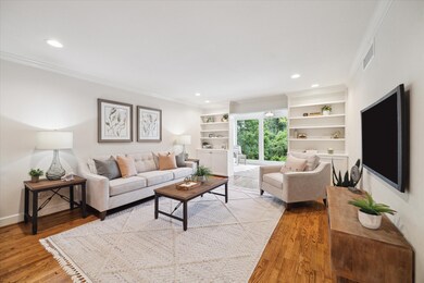 The living area is spacious and has custom book sh