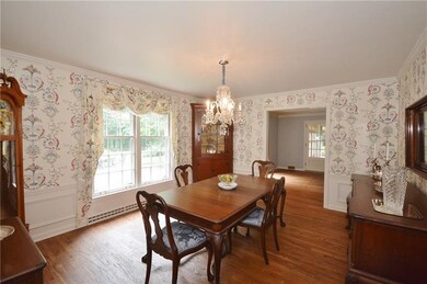Beautiful moldings in sun-soaked formal dining roo