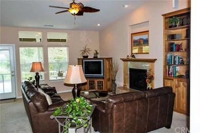 Great room with gas fireplace and built-in book sh