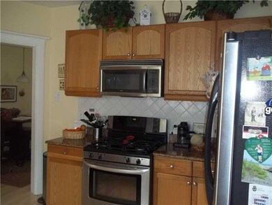 Kitchen. Soft tones, neutral back splash, & light 