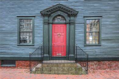The fanlight door with side pilasters made such a