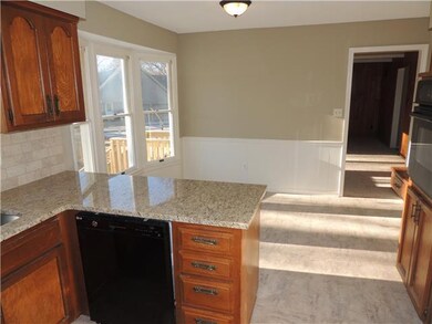 Ample Storage, Granite Counters and Attractive Til