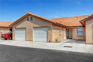 Mediterranean / spanish home featuring a tile roof, an attached garage, stucco siding, and concrete driveway