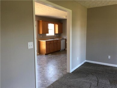 Spacious living room looking into kitchen!