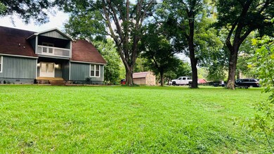 View of green lawn with a balcony
