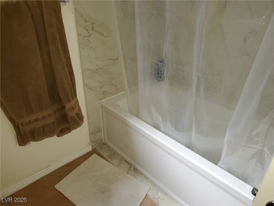 Full bath with shower / bathtub combination with curtain and baseboards