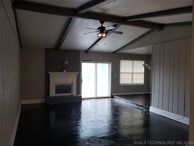 Sunken living room with fireplace and vaulted ceil