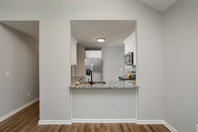 Pass thru from dining area is perfect for entertaining.