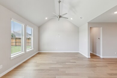 Living room in the Masters home plan by Trophy Signature Homes – REPRESENTATIVE PHOTO