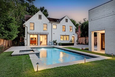 Enjoy wonderful outdoor entertaining in this lovely yard featuring a saltwater pool and spa, tiled patio space, a new motorized awning and manicured landscaping.