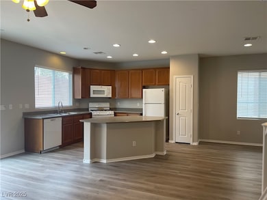 Kitchen featuring light wood-style flooring, reces