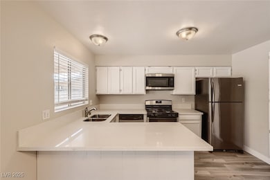 Kitchen featuring appliances with stainless steel