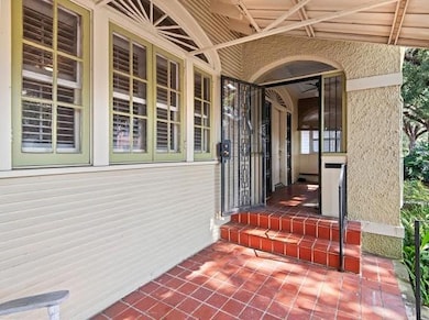 Covered front porch on shaded street