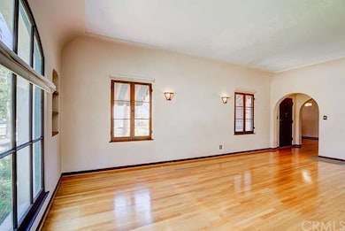 Alternate view of spacious living room with sconce