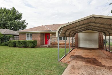One car garage with a carport.