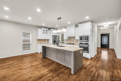 Bright Open Kitchen with gas cooktop, stainless ap