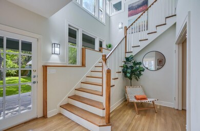 Stairs with healthy amount of natural light and w