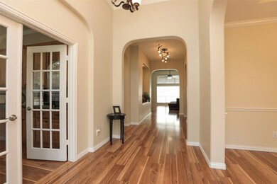 Entry has arches with beautiful flooring!   Study to the left with french doors.  Dining Room to the right!