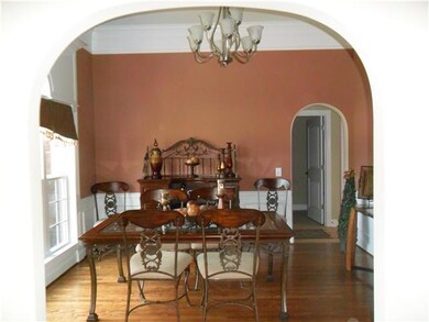 Formal Dining Room with beautiful arch.
