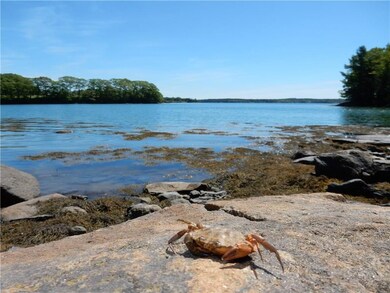 Sandy and rocky shoreline, with...