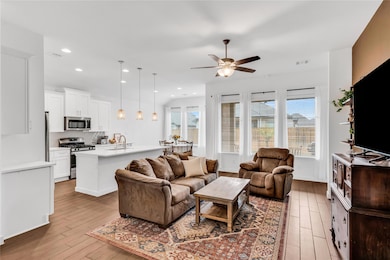 Living area featuring visible vents, wood finishe