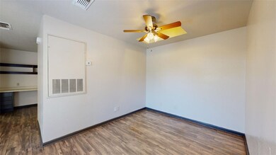 Empty room featuring dark hardwood / wood-style fl