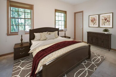Virtually staged main level bedroom with en-suite