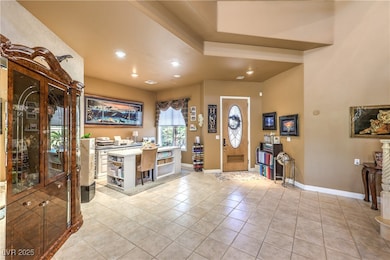 Foyer with recessed lighting, baseboards, and ligh