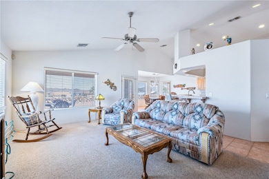 Living area with plenty of natural light, a ceilin