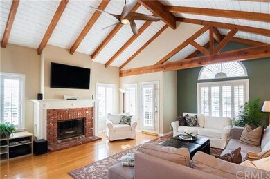 As you enter the living room: soaring beamed ceili