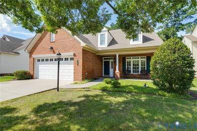 Lovely Brick Home with Large Front Porch and 2 Car Garage.