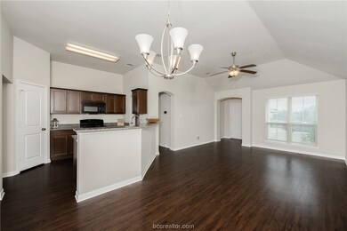 Living room, kitchen, viewed from dining room.