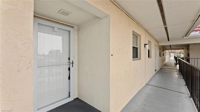 Doorway to property with a balcony