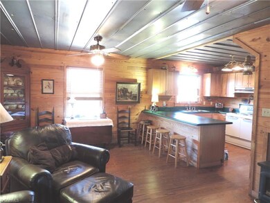 Open gathering area from great room through breakfast area into kitchen.