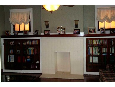 Living Room. BUILT IN BOOK SHELVES