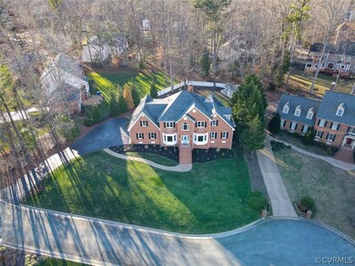 This luxury brick home rests on an idyllic lot fra