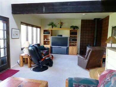 Spacious and light-filled living room wi
