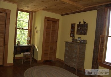 Master Bedroom: wood floors & ceiling and double c