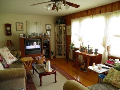 Living area with large picture window for lots of natural light. 