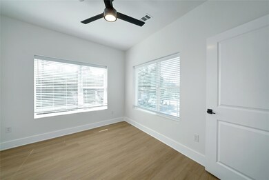 Empty room featuring light wood-type flooring, a 