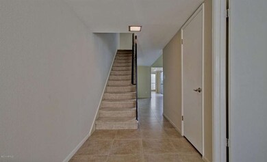 Entryway and stairway to upper floor