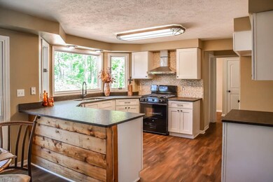 The remodeled kitchen has shiplap accents and gran