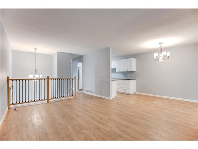 Open floor plan boasts tile entry with split stair