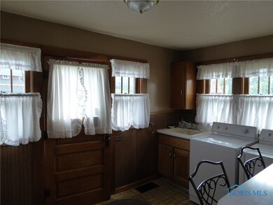 Inside the back door main floor laundry.