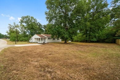 This charming home sits on almost an acre of prope