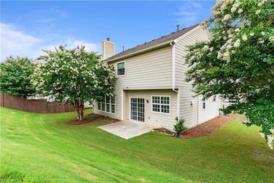 Back of house with patio area