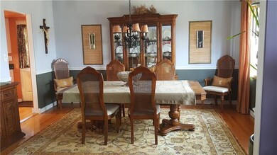 The formal diningroom is large enough for entertai