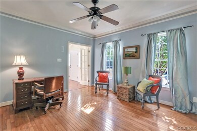 Another view of the office/living room; crown molding, hardwood floors, ceiling fan