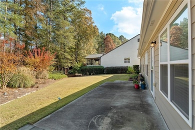 View of patio featuring view of wooded area